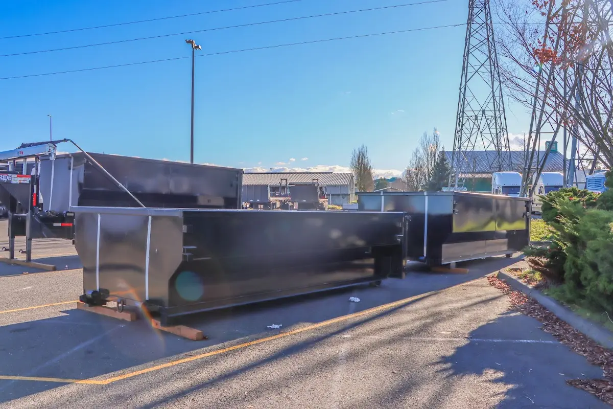 Roll-off dumpster ready for waste disposal at job site for Demolition Dumpster Rental in Willis